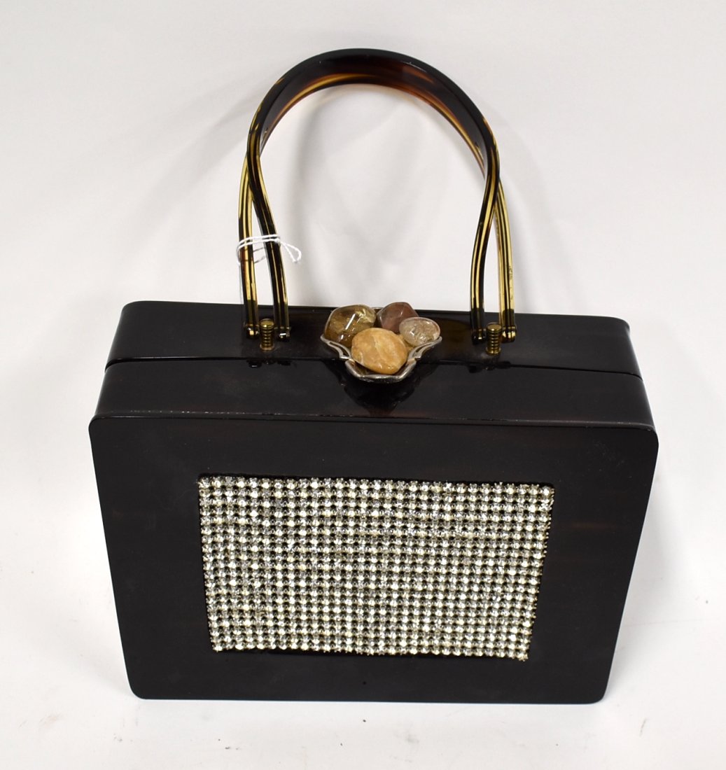 Unusual Wilardy New York Evening Bag: Brown lucite handle, unusual "pendant" type gemstone on silver clasp, very dark lucite body looking black and a marcasite panel at the front. Label at the interior
