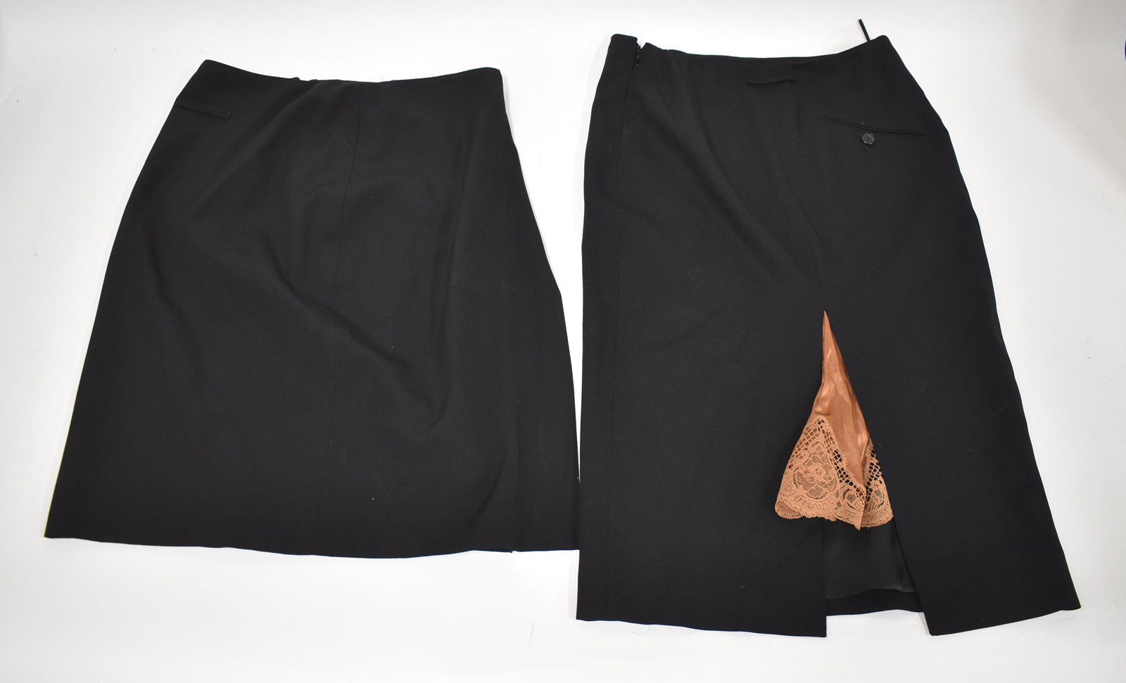 Jean Paul Gaultier Skirts (2): Size 4 Lana With label. Lined back Pleat reveals a brown lace trimmed pc. of fabric resembling an underslip. Included in the lot is a second Jean Paul Gaultier skirt, Size 10 US. Favric" Tejido, light