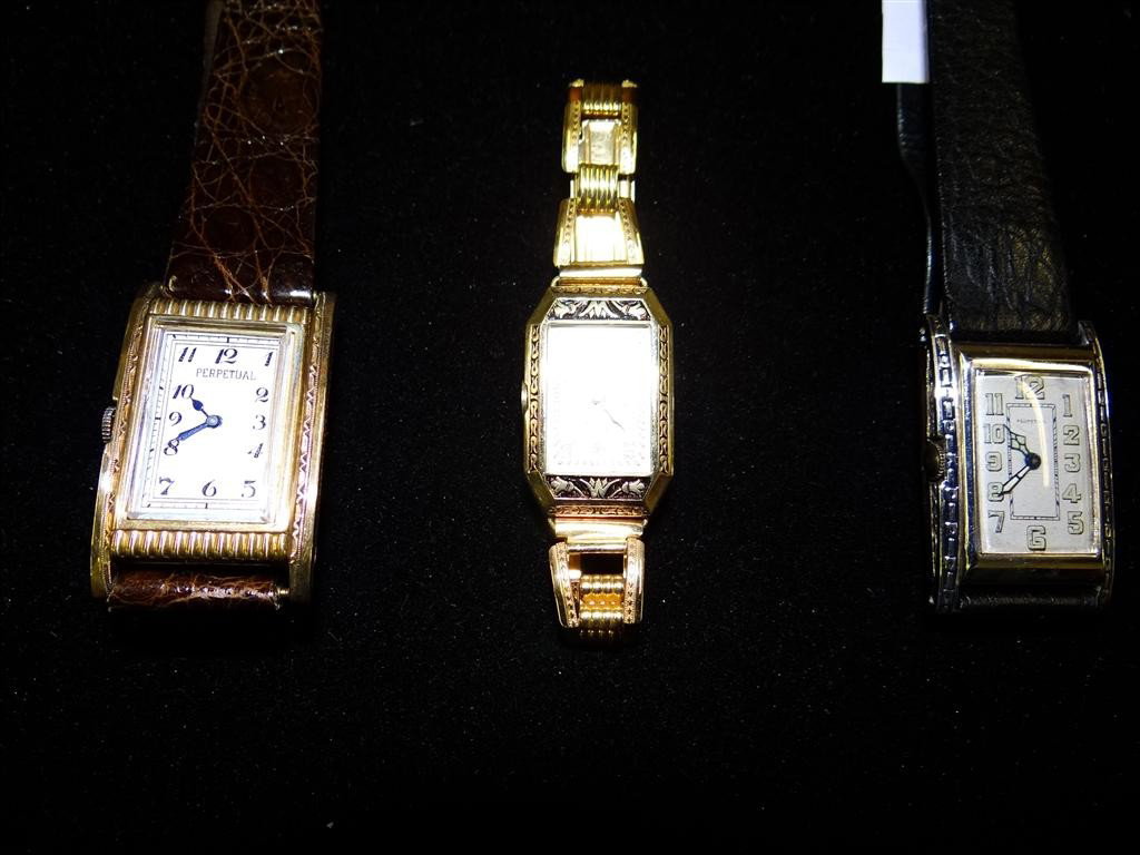 THREE PERPETUAL WRISTWATCHES: Early automatics including scarce lady's with champleve enamel bezel, metal strap, 18mm; two men's long rectangular both 23mm width, exotic skin bands