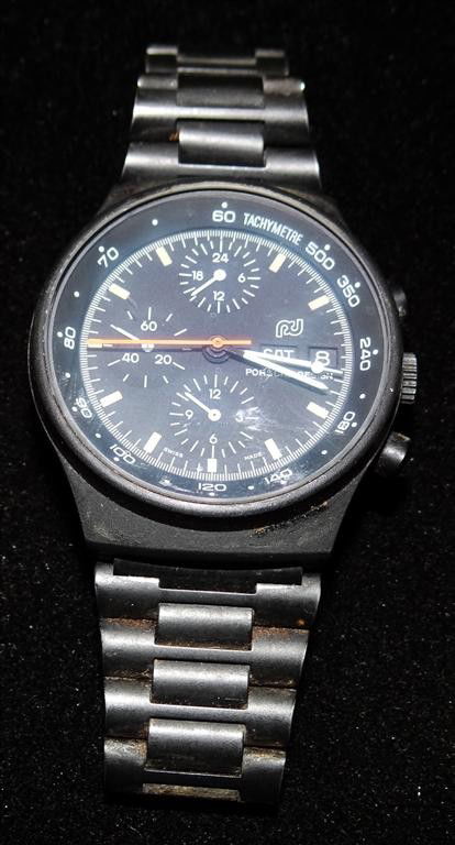 PORSCHE DESIGN MAN'S WRISTWATCH: Automatic day-date chronograph with minute and hour registers in addition to constant seconds, black dial, red sweep, titanium case and bracelet, 39mm