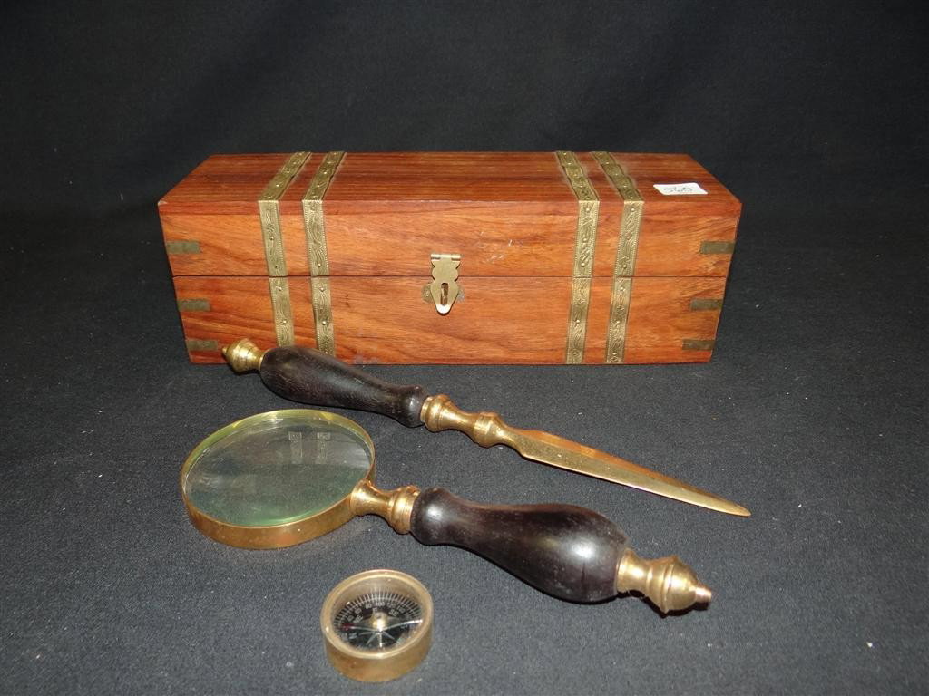 SHIP'S DESK SET IN WOODEN BOX: With brass bounds to include a letter opener, magnifiying glass & a compass. Box measures 10-1/2" w. x 3-1/2" long