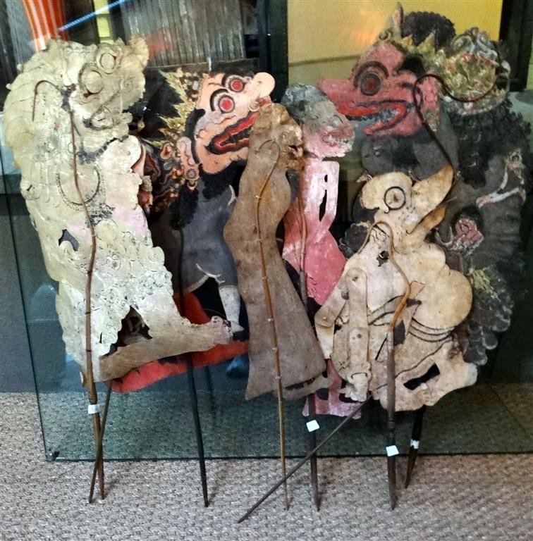 SIX INDONESIAN PAPER PUPPETS ON WOOD STICKS: 19th C. paper puppets. In as is condition. 24" high to 34" high