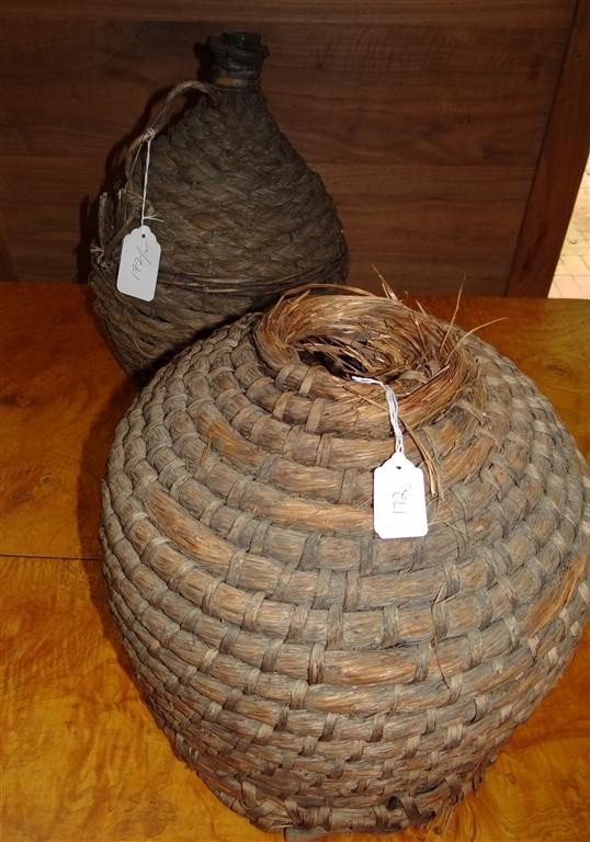 AMERICAN EARLY 20TH C. STRAW BEEHIVE: Together with straw jug with glass interior. 11-1/2" to 15" high