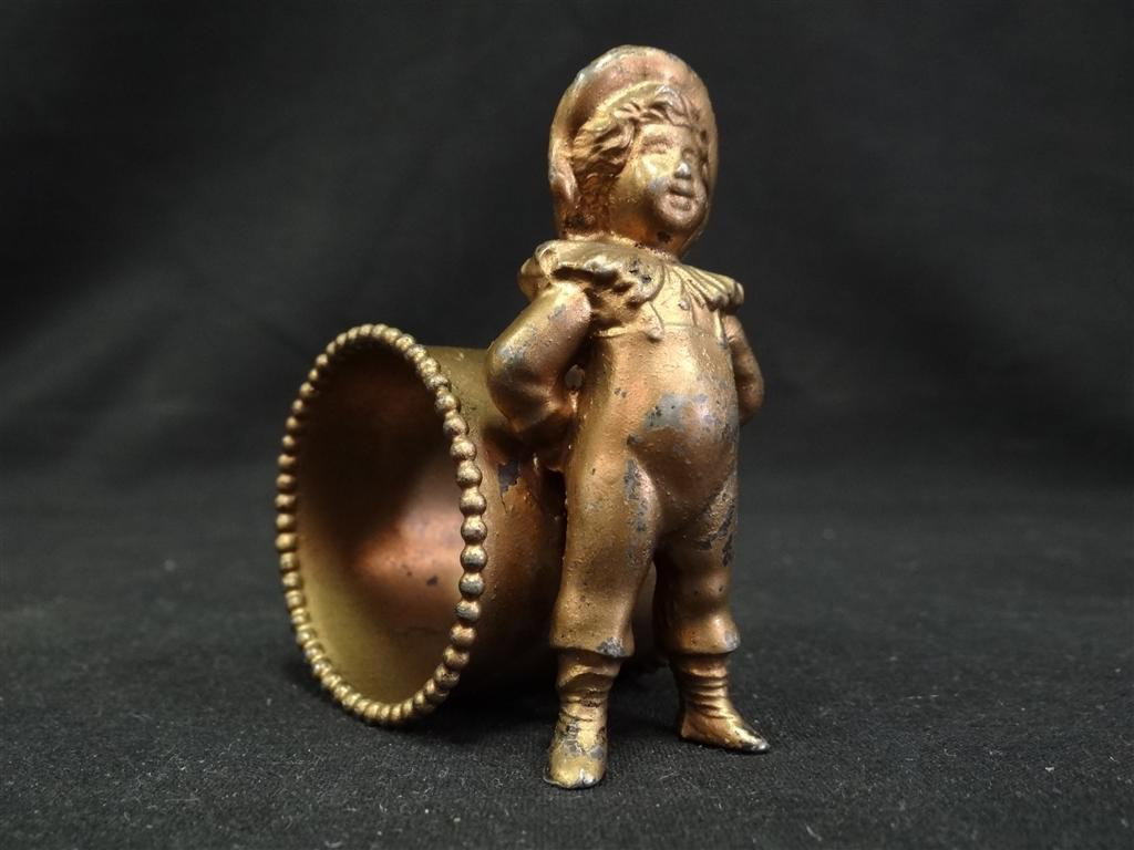 KATE GREENAWAY FIGURAL NAPKIN RING: Kate Greenaway boy with his back to the napkin ring