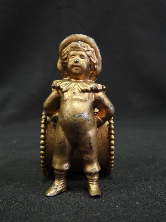 KATE GREENAWAY FIGURAL NAPKIN RING: Kate Greenaway boy with his back to the napkin ring