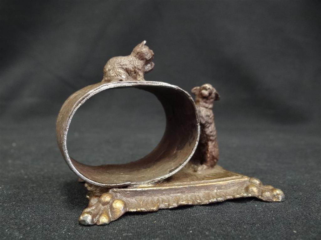 AMERICAN VICTORIAN NAPKIN RING: Figural napkin ring, oval, a cat and a dog play on the rectangular base. Barbour Co.