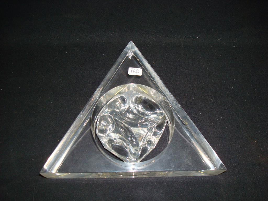 MODERNISTIC LUCITE KINETIC DESK TOY: A lucite ice cube shape spins inside the interior cut out circle of a lucite triangle. 6 1/2"H