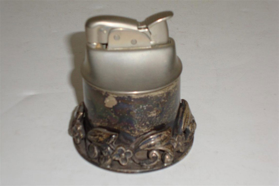 GEORG JENSEN STERLING SILVER TABLE LIGHTER: Diminuitive. Very ornate base. Marked Georg Jensen Inc. Sterling U.S.A.Numbered 160 2 1/4'H