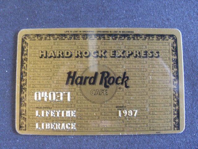 LIBERACE'S HARD ROCK CAFÉ EXPRESS CARD: Gold and black to simulate The American Express Card #04037 Lifetime card of Liberace. Member since 1987. "Life is Lost in Dreaming - Dreaming is Lost in Becoming" Love All - Serve All printed on card