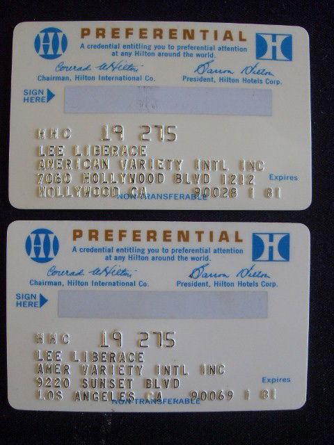 TWO LEE LIBERACE HILTON CARDS: Preferential Hilton Cards (both the same.) Raised lettering for Lee Liberace Amer. Variety Int.'l Inc. 9220 Sunset Blvd. Los Angeles, CA. 90028 on one card and 90069 on the other. Both expire 1/81.
