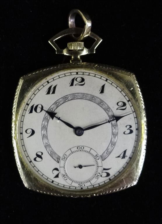 CARY JAMES 14K GOLD POCKET WATCH: A gift from Liberace irregularly shaped face has arabic numerals, a second hand, and blue luminescent regular hands.Monogram at back CWJ marked HW (Wheeler) 17 jewels.