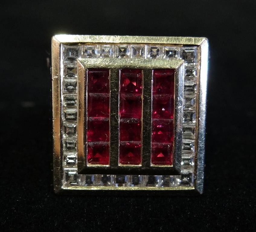 18K GOLD DIAMOND AND RUBY RING: The 18K gold ring is inlaid with square cut diamonds and rubies, and was frequently worn by Liberace. The lot is accompanied by three photographs of Liberace wearing the ring. 0.80 oz., 22.7 grams.