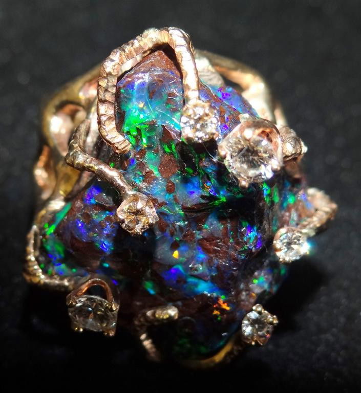 14K GOLD FIERY OPAL AND DIAMOND RING: A Liberace favorite. .75 Carats of diamond. Total weight 1.3oz, 36.6 grams.