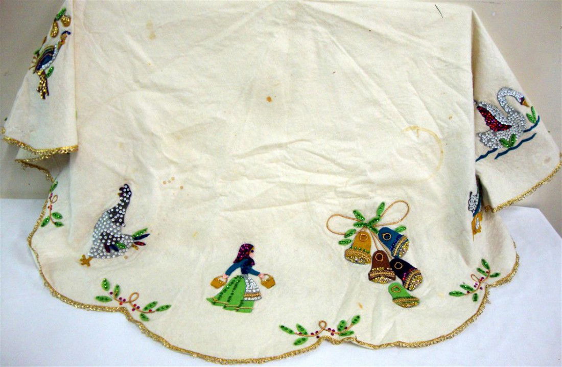 LIBERACE'S CHRISTMAS TREE SKIRT: Felt with applied felt and sequined applications. Round, some staining.