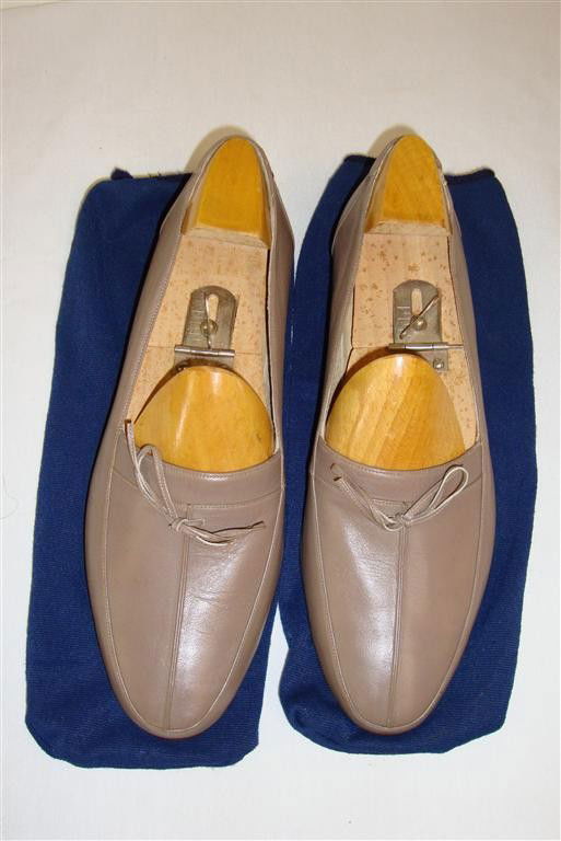 LIBERACE'S ROSSI LEATHER LOAFERS: Dark tan loafers size 11-1/4. With Rossi label in blue stretch knit bags.