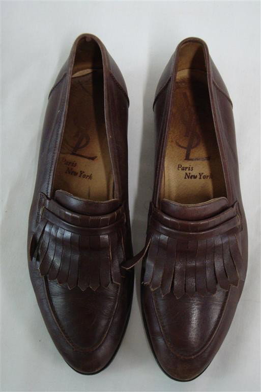 LIBERACE'S YVES ST LAURENT LOAFERS: Marked with the intertwined YSL monogram on the inside. Paris New York. One shoe last with and L on it.