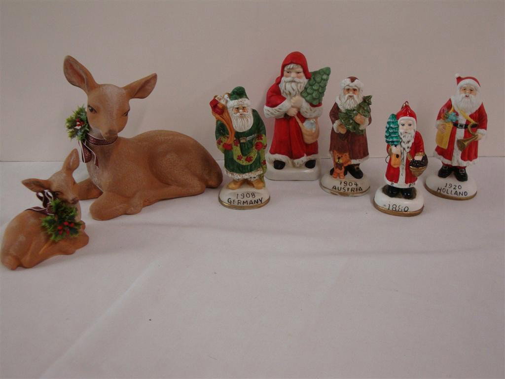 CHRISTMAS DECORATIONS (7): 5 Ceramic santa figures together with 2 porcelain deer. Lot is accompanied by several candid photographs of Christmas at Liberace's home.