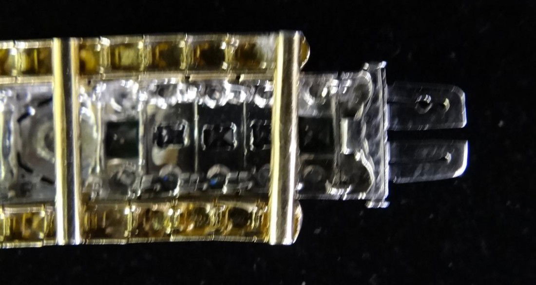 CHATUM EMERALD "DIAMOND" & "GOLD" BRACELET: Liberace purchased this from a jeweler in Florida who misrepresented all the emeralds as being genuine. Half the emeralds are manmade Chatum. There is an expander on the bracelet to create a masculine