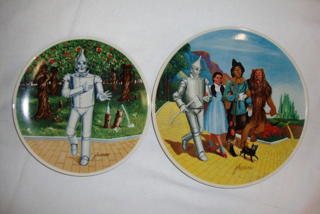 TWO WIZARD OF OZ COLLECTORS PLATES: If I Only Had A Heart -- by Knowles with certificate of authority; and The Grand Finale (We're Off To See The Wizard.) Both by James Auckland. 8-1/2" wide and 10" wide