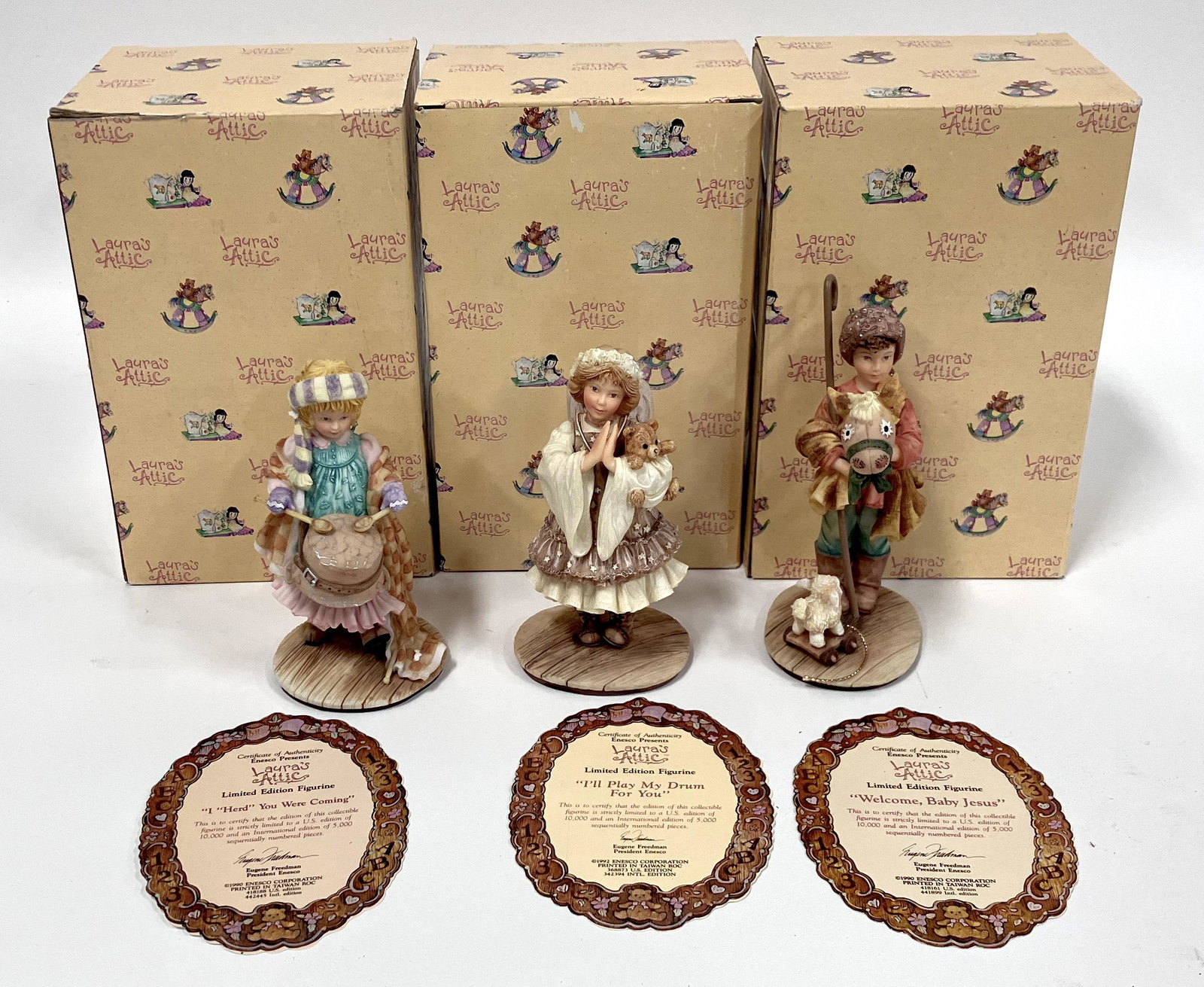 Laura's Attic Figures (3): By Karen Hahn, Welcome Baby Jesus; I'll Play My Drum for Her; I "Herd" You Were Coming . 5 1/2"H. Three in a Lot .