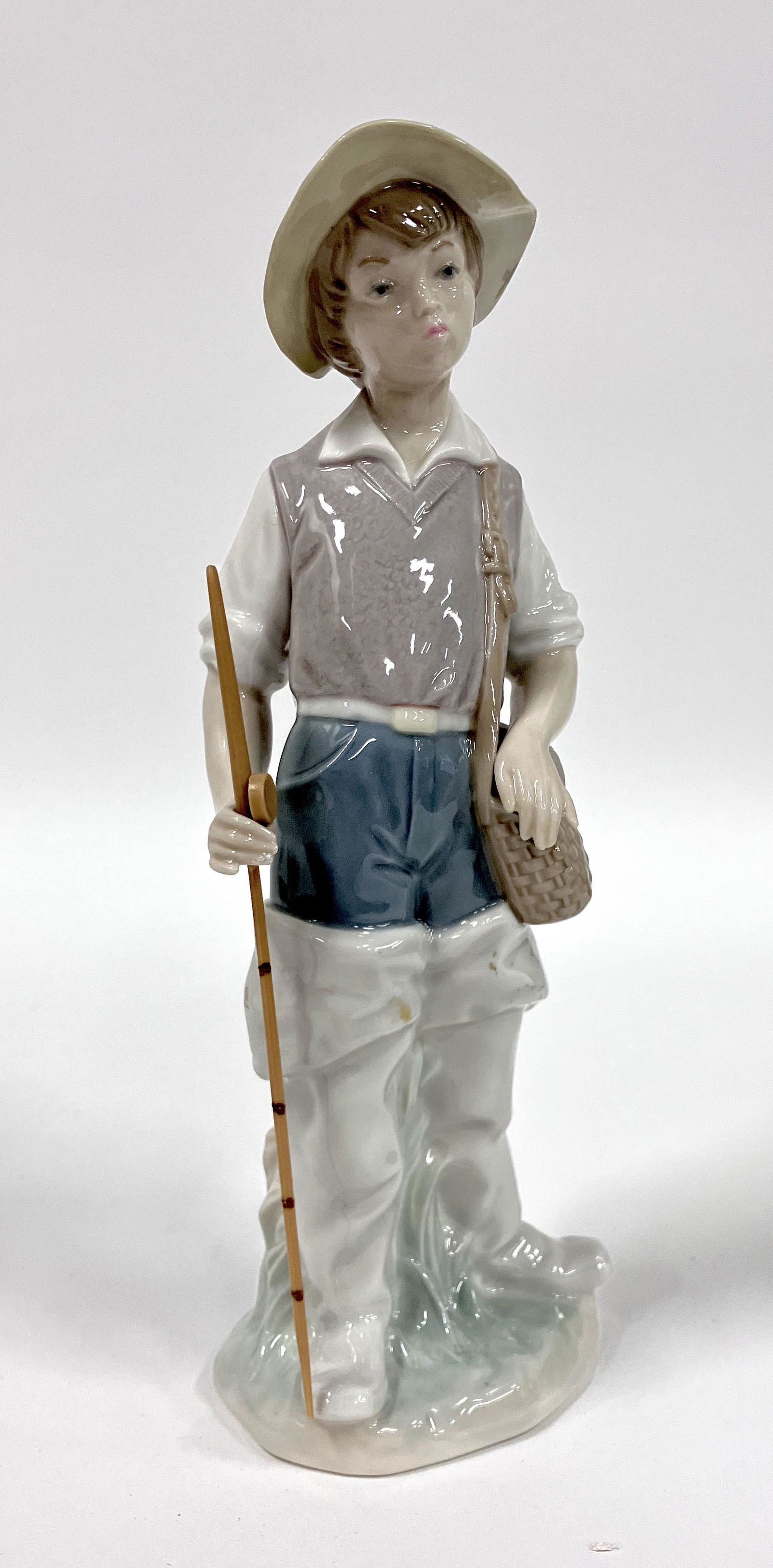 Lladro Figure. Boy Figure. (1 of 4)