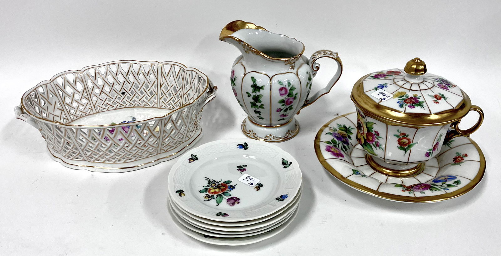 Collectors Lot of Antique KPM, (10): KPM covered handled bowl; with underplate. ; a Nymphenberg reticulated bowl marked at the underside; six Nymphenberg saucers and a KPM creamer.