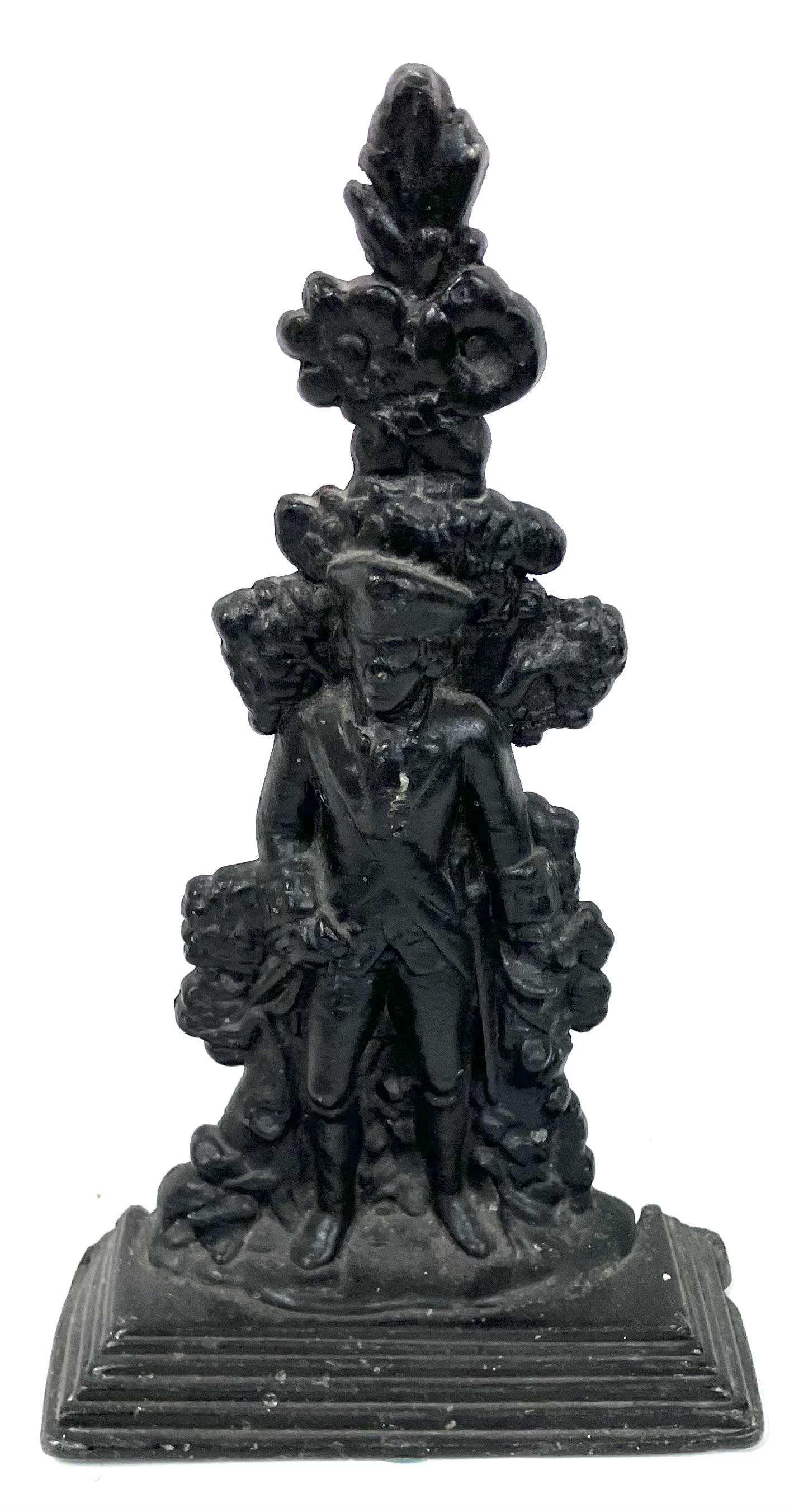 Antique G. Washington Cast Iron Doorstop: Detailed and ornate. Stepped base. 12"H.