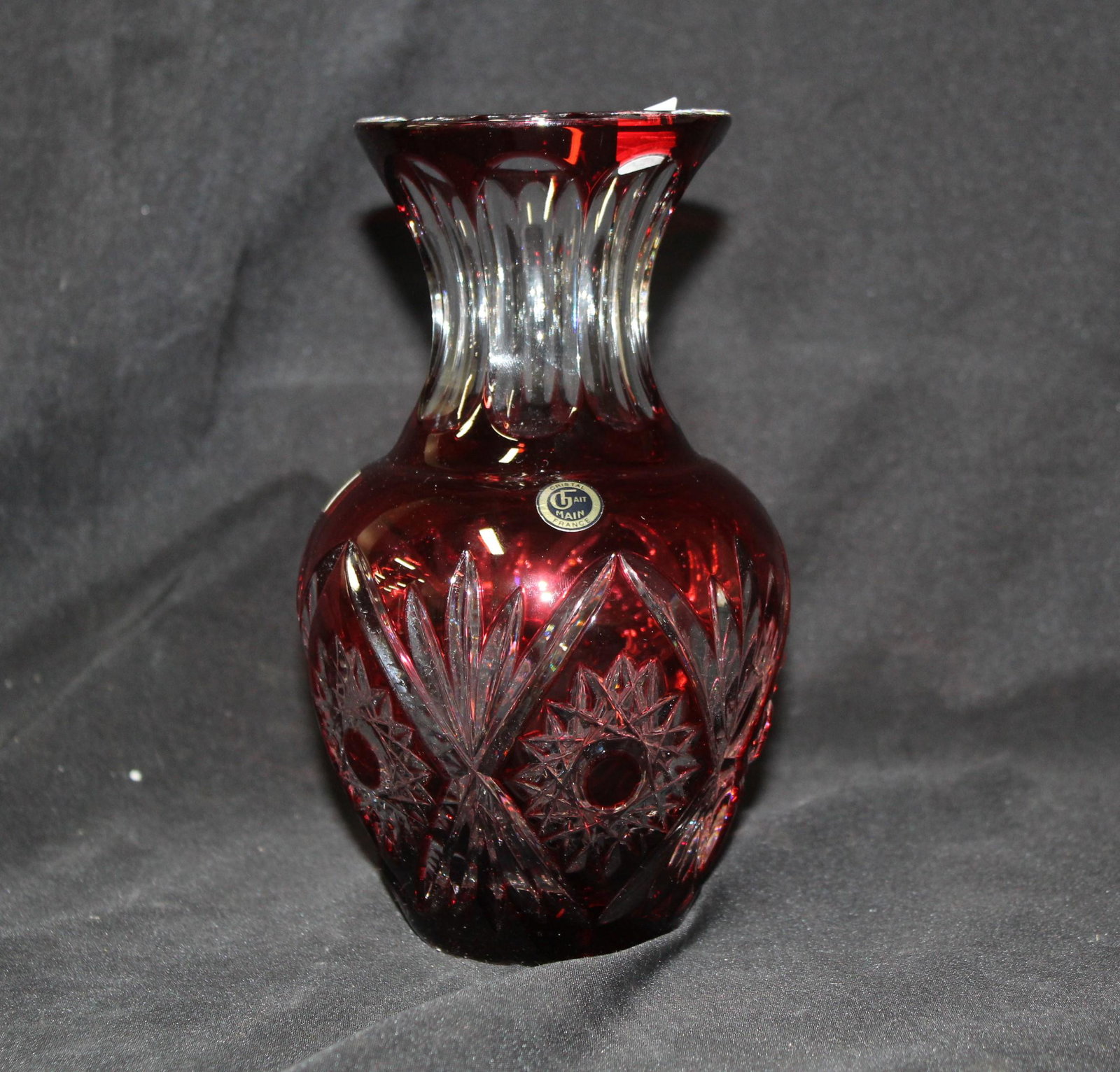 Baccarat Cranberry Glass Vase: With labels. One marked Crystal Made in France and the second label says Baccarat. 8"H.