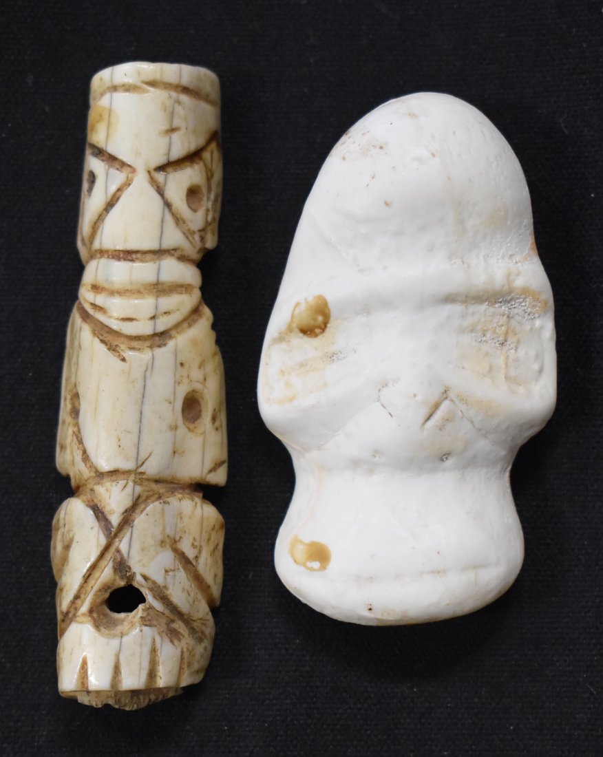 Taino Amulets of Shell & Manatee Bone (2): These are both from Southern Puerto Rico. The elongated one is of manatee bone, a rather primitive carving with lower drill hole. The elongated one is of manatee bone, a rather primitive carving with 