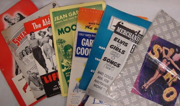PRESSBOOKS AND MERCHANDISING MANUALS (8): Oversized book for SRO; Elvis Presley in Girls! Girls! Girls!; Lured; High Noon; Moontide; Life With Henry autographed by Eddie Bracken; Sweater Girl autographed by Eddie Bracken; and You'll Never Get