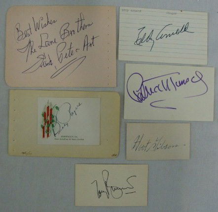 MUSIC AUTOGRAPHS BUDDY ROGERS TO TONY BENNETT: Buddy Rogers signed in ink on a Christmas gift card; Tony Bennett signed in ink on a card; The Lane Bros. signed Best Wishes, The Lane Brothers, Frank, Pete and Art on a pink album page; Eddy Arnold s