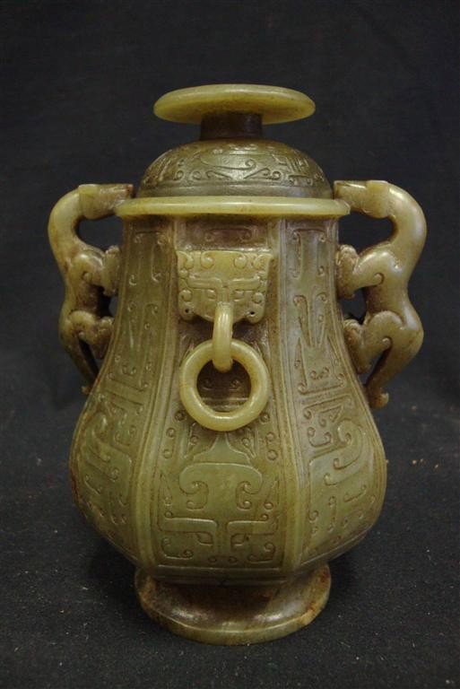 COVERED JADE VESSEL CARVED WITH CHIMERAS: Chimera handles. Early Western Zhou period. Archaistic style. Taotie mask designs. 6” high