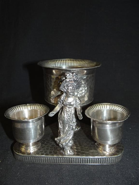 KATE GREENAWAY SMOKING SET: James W. Tufts Co #3252 A cigarette holder and two removeable match holders on a triangular base. 5"H. x 6 1/2"W