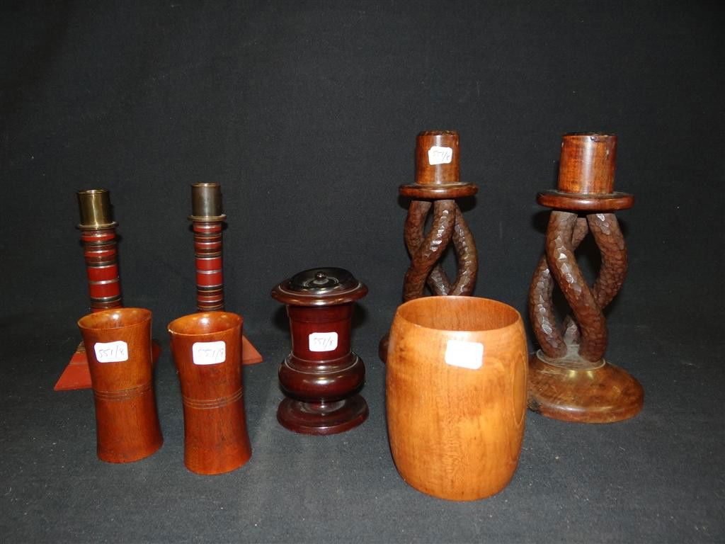 LOT OF EIGHT MISCELLANEOUS WOOD ITEMS: Signed H. Robell in red at the bottom and dated 1933, 8.5IN. H.; Inlaid candlesticks with rosewood, brass, silver and other hardwoods with brass holders at the top, 6.5in. H.; four(4) dice cups. All a