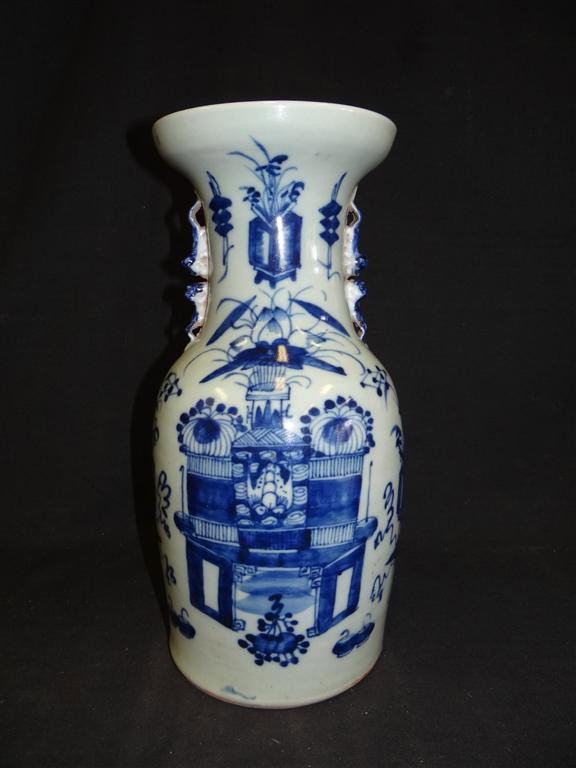 CHINESE PORCELAIN VASE: Hand painted porcelain vase. Salt glazed decorated with blue floral sprays in a garden setting; 16.5in. H.