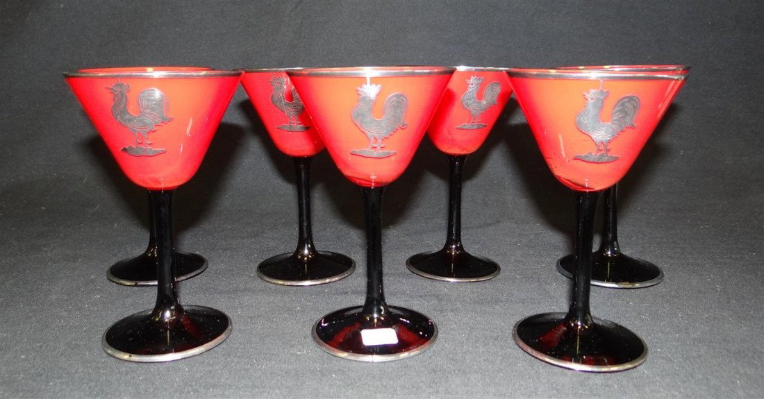 PAIRPOINT ART DECO STEMMED WINES (7): Red glass with a black stem. Sterling rooster decoration. 5"H