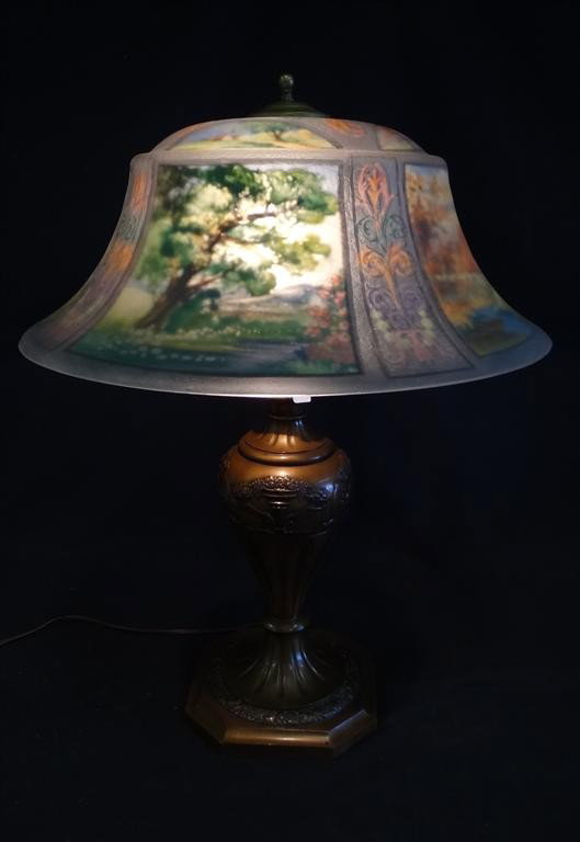 PAIRPOINT REVERSE PAINTED TABLE LAMP: With reverse painted panels representing The Four Seasons of the year. Has a old chip fill and a rim chip at the inside. Signed on the base Pairpoint Mfg. Co. and numbered D3055 26"H. 20"D.