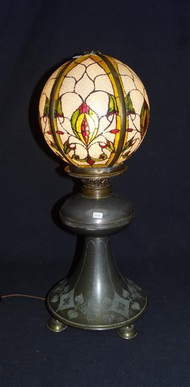 ARTS AND CRAFTS PAIRPOINT LAMP: Reverse painted closed globe. Signed Pairpoint Mfg. Co on the base. Signed Pairpont 1897 19 1/2"H. 7 1/2"W