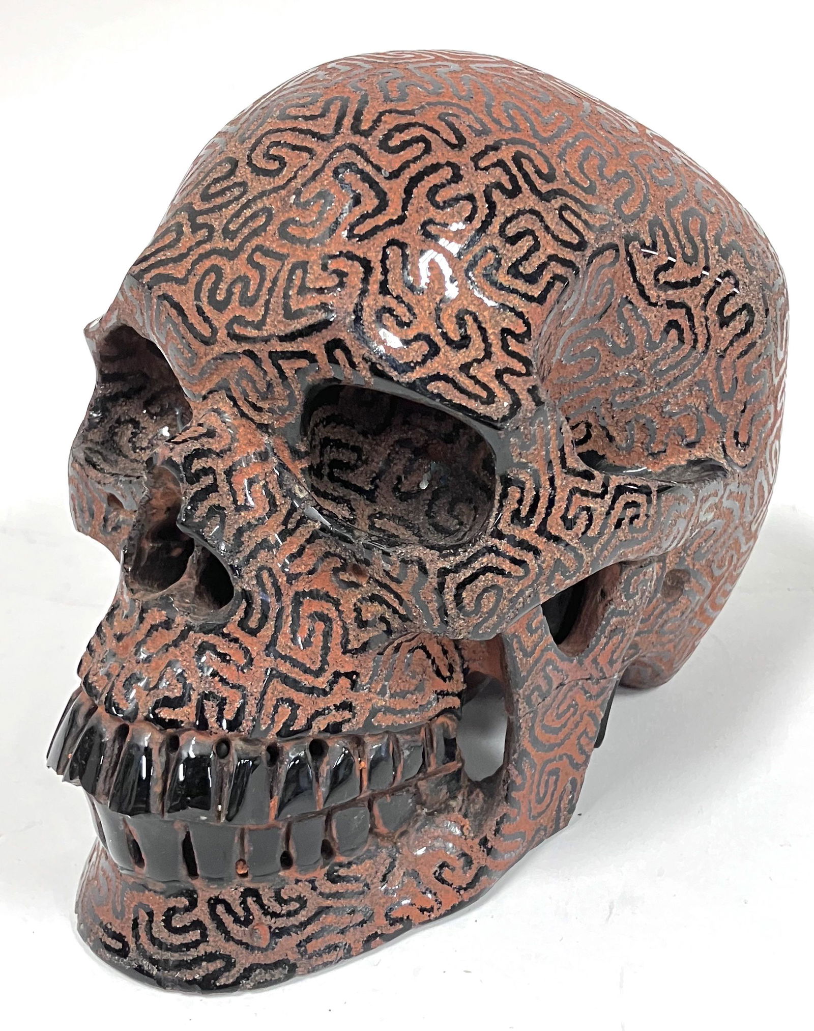 Carved Black and Orange Colored Skull (1 of 4)
