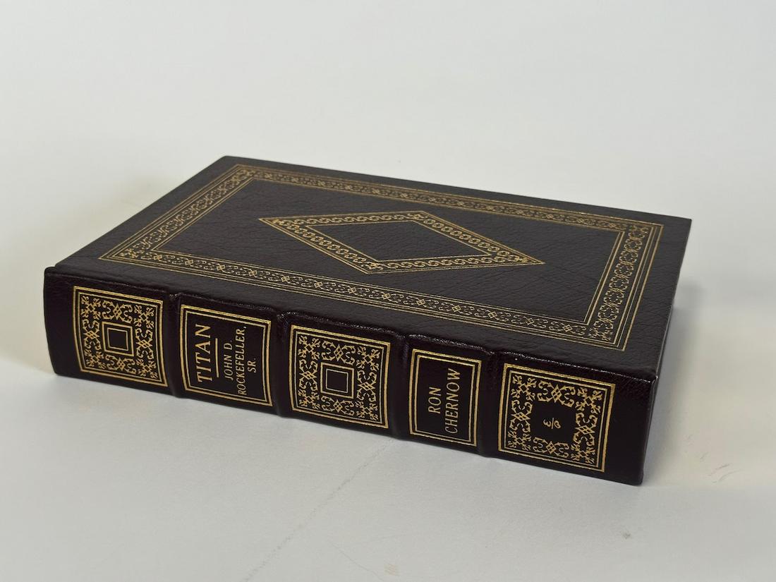 Titan - John D. Rockefeller, Sr., Ron Chernow; Easton Press: Black leather bound, 2000. Most books in this collection are in Unused Condition. Some have minor flaws from sitting on book shelves that we'll show when photographing if significant enough.