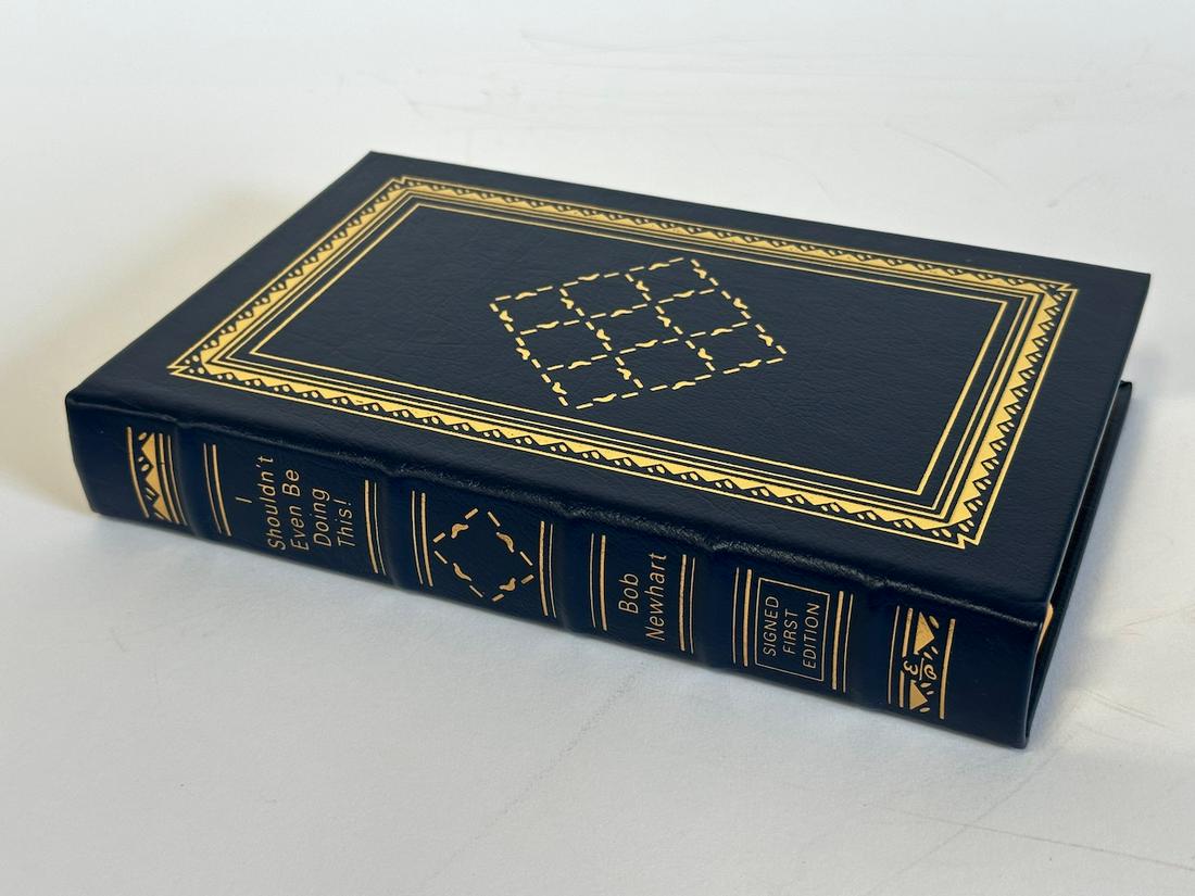 I Shouldn't Even Be Doing This! Bob Newhart - Sgd. First Edition; Easton Press: Blue leather bound, 2006. Most books in this collection are in Unused Condition. Some have minor flaws from sitting on book shelves that we'll show when photographing if significant enough.