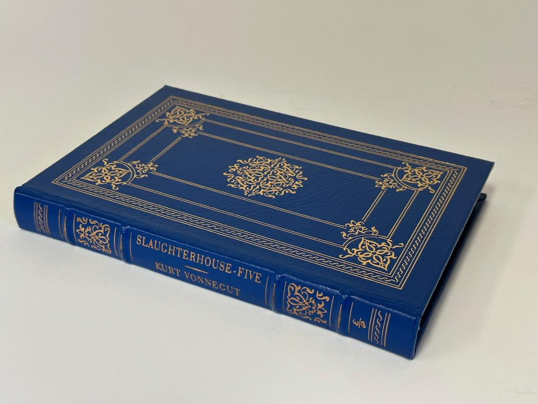 Kurt Vonnegut;Slaughter House Five Easton Press: Cobalt blue leather bound. Most books in this collection are in Unused Condition. Some have minor flaws from sitting on book shelves that we'll show when photographing if significant enough.