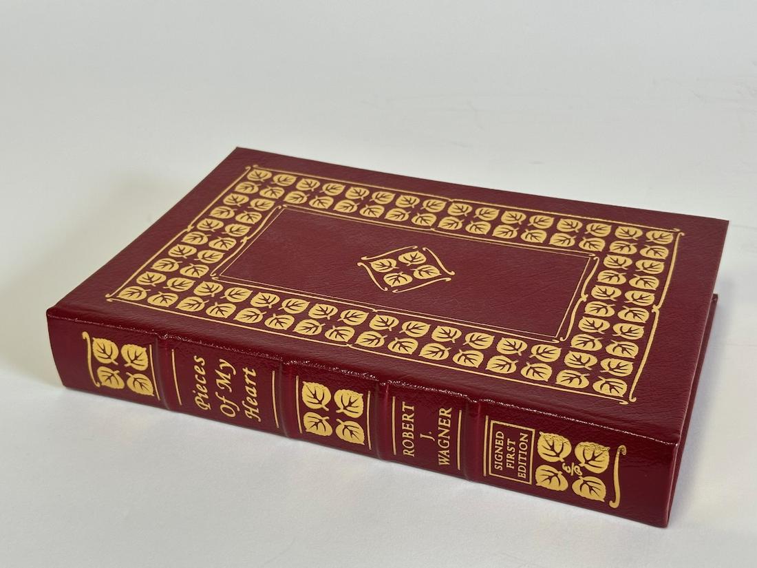 Pieces of My Heart, Robert J. Wagner - Sgd. First Edition; Easton Press: Red leather bound, 2008. Most books in this collection are in Unused Condition. Some have minor flaws from sitting on book shelves that we'll show when photographing if significant enough.