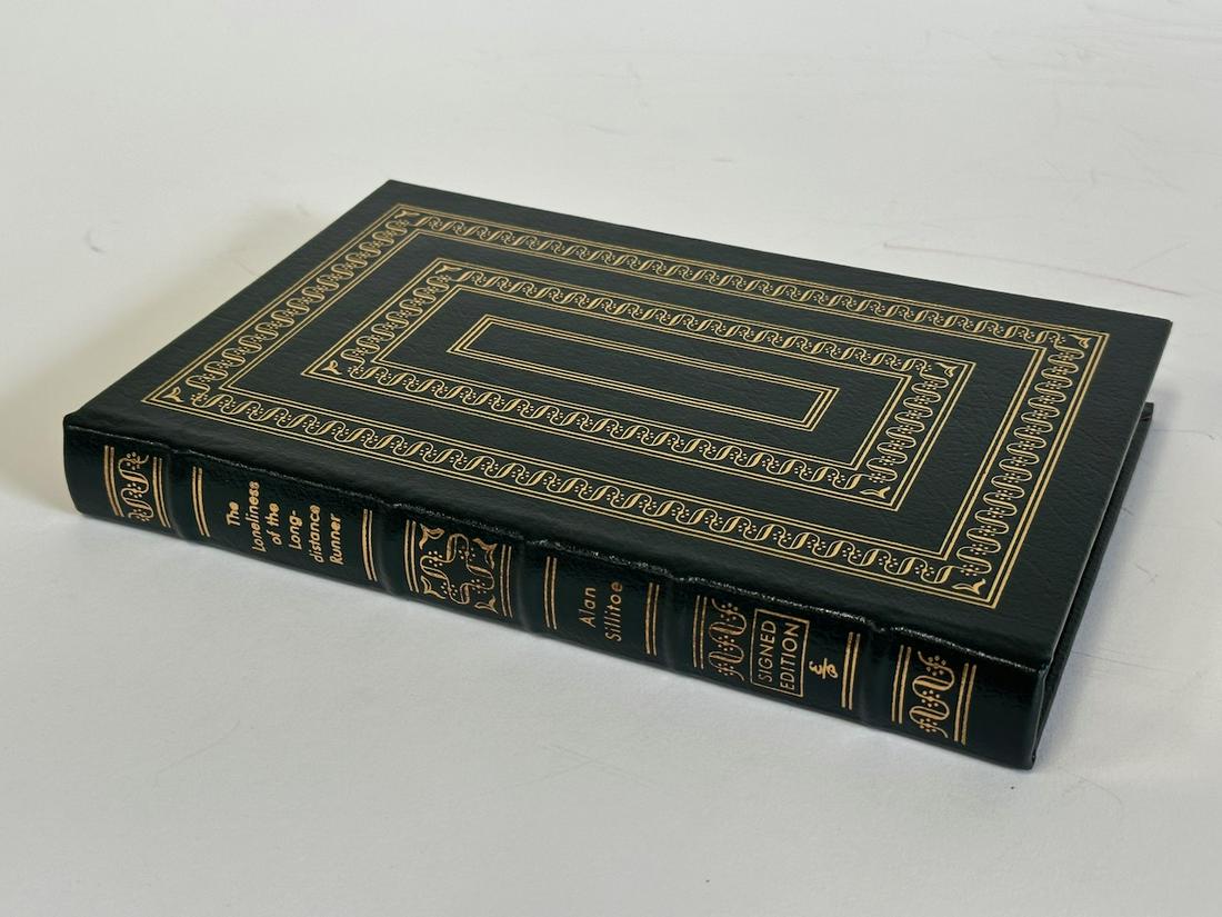 The Loneliness of the Long Distance Runner, Alan Sillitoe - Sgd. First Edition; Easton Press: Green leather bound, 2002. Most books in this collection are in Unused Condition. Some have minor flaws from sitting on book shelves that we'll show when photographing if significant enough.