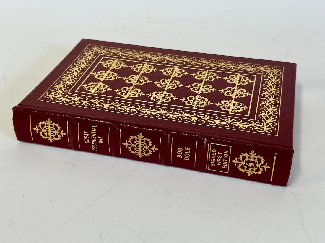 Great Presidential Wit, Bob Dole - Sgd. First Edition; Easton Press: Red leather bound, 2000. Most books in this collection are in Unused Condition. Some have minor flaws from sitting on book shelves that we'll show when photographing if significant enough.