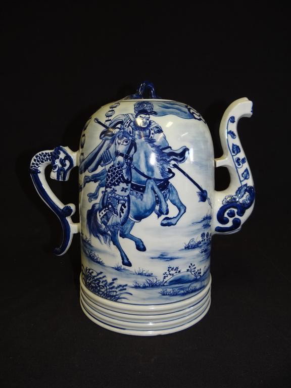 CHINESE PORCELAIN TEA POT: Blue and white decorations. Dragon handle. Beehive form. Four character mark. 11"H.