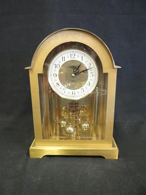 HOWARD MILLER BRASS CLOCK: Brass atmos clock. Made in West Germany; 10in. H.