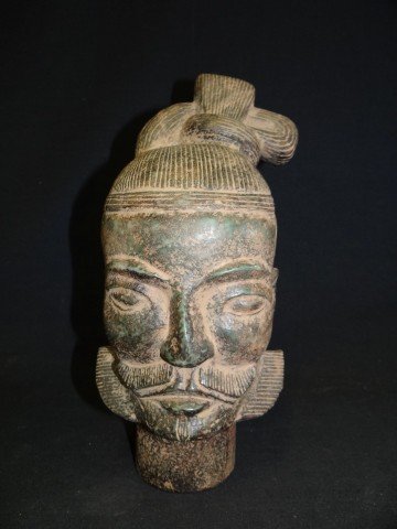CARVED STONE HEAD OF A WARRIOR: In Han Dynasty style. 11 3/4"H.