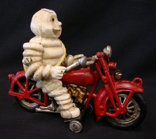 Cast Iron Michelin Man toy: Contemporary cast iron Michelin man toy 8 1/2"L 6 3/4"H.