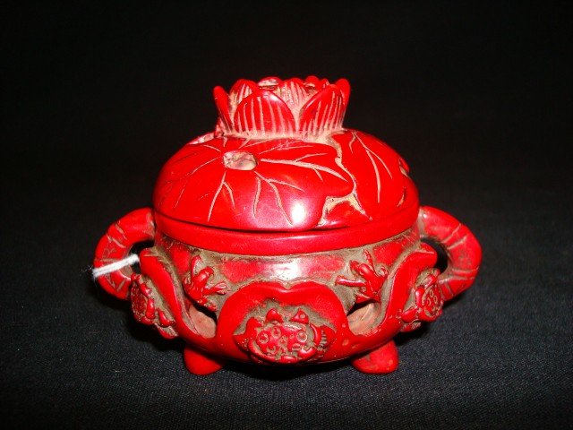 19th C. Chinese cinnabar incense burner: Well carved Old Peking cinnabar incense burner. Lotus flower decoration; 2.75in. H.